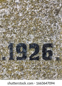 "1926" chiselled out of granite and polished – a detail of an inscription produced that year. Covered with lichen