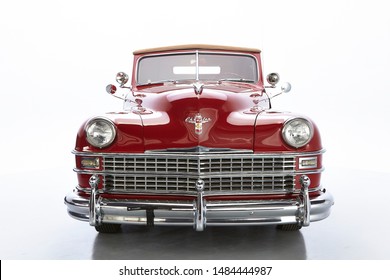 1946 Chrysler Town & Country Roadster. Front Shot Of A Classic American Vintage Car. Isolated. Chrome Bumper And Grill
