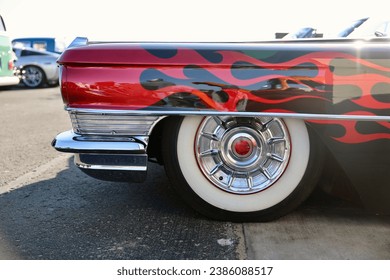 1950s restored muscle car with red flames