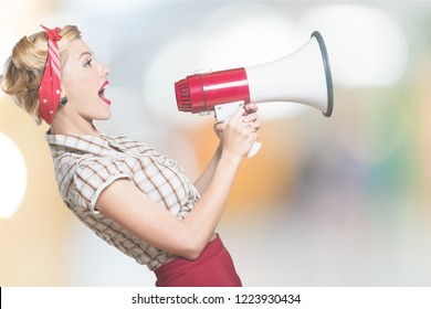 1950s Style Housewife Yelling Into A Megaphone - Isolated Image