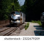 1956 F9 diesel locomotive leads the Nickel Plate Express excursion train in Noblesville, Indiana, USA, as it approaches Hobbs Station in Forest Park.