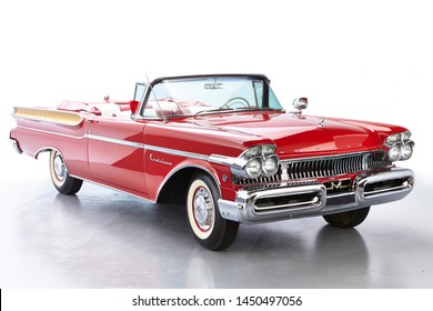 1957 Mercury Montclair Convertible isolated. Classic car once owned by Dick Clarke. Chrome whitewalls and giant fins on this vintage car