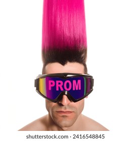 1980s retro guy with tall straight pink mohawk wearing ski goggles that say PROM inside them over his eyes facing forward no background