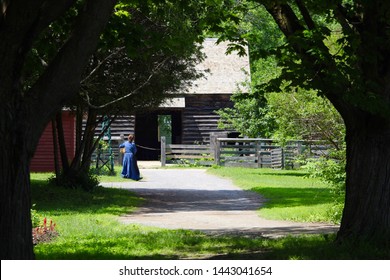 19th Century Canadian Farming  Town With Dirt Road. Barn. Background.  