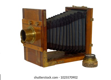 19th century folding photo camera, with bellows for focusing, isolated - Powered by Shutterstock