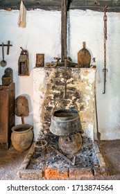 19th Century Log Cabin Interior. Old Times Farmhouse - Interior Of An Old Country House With Fireplace And Kitchen