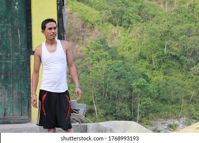 19th May 2011- A Sikkimese man stands in a White vest and black shorts in the state of Sikkim, India
