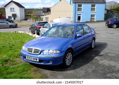 1st April 2022-  A Classic Rover 45 Impression S3, Five Door Hatchback Car, Parked In A Public Parking Area Bear The Town Centre At St Clears, Carmarthenshire, Wales, UK.