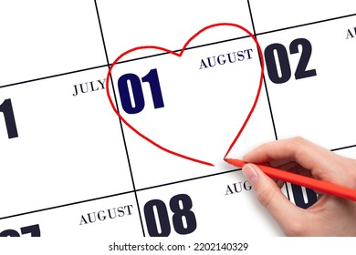 1st Day Of August. A Woman's Hand Drawing A Red Heart Shape On The Calendar Date Of 1 August. Heart As A Symbol Of Love. Summer Month. Day Of The Year Concept