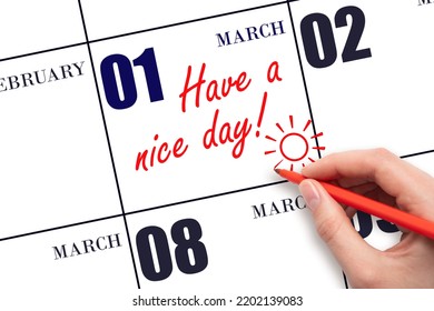 1st Day Of March. The Hand Writing The Text Have A Nice Day And Drawing The Sun On The Calendar Date March 1. Save The Date. Spring Month, Day Of The Year Concept.