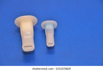 1st May 20222, England,UK- Adult and paediatric Oral airways used during intubation and anaesthesia .Image isolated on a blue background