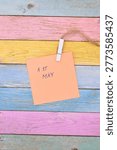 1st may write on card on rustical wooden background 