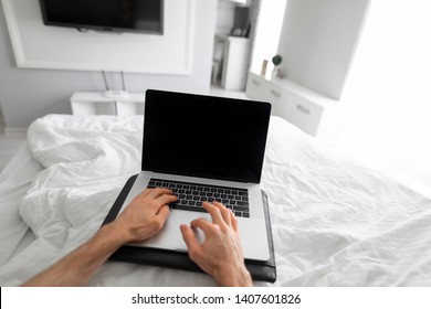 1st Person View Man Using Laptop In A Bed