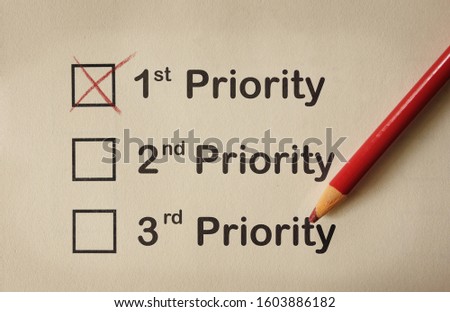 1st Priority box checked above second and third on paper with red pencil                               