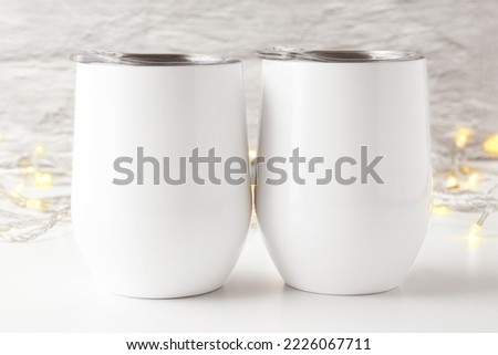2 Blank white wine tumbler with lid mockup in white gray background. Double tumbler.Minimalist style, front view, white copy space. svg product mockup, svg product display, mockup for svg drinkware.