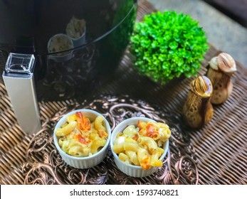 2 Bowls Macaroni Cheese Baked With Air Fryer On The Rattan Table.Outdoor,garden,balcony View.