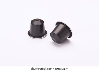 2  coffee capsules isolated on white