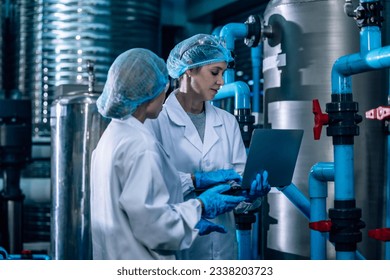 2 Drinking Water Quality Officer perform effective assessment, monitoring reverse osmosis systems to maintain high standard, efficiency, safety, while controlling contamination through expert testing - Shutterstock ID 2338203723
