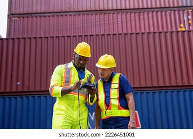 2 engineer working in container storage yard use digital tablet check quantity prepare to delivery