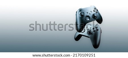 2 game controllers floating on gradient background - future of gaming concept