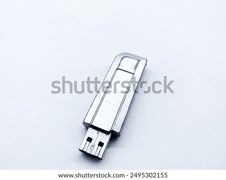 2 gigabyte silver flash disk, this photo has a white background. 