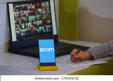 2 June 2020. Istanbul / Turkey. Smart Phone Showing Zoom Cloud Meetings App And Kid Running Lesson Across The Screen.
