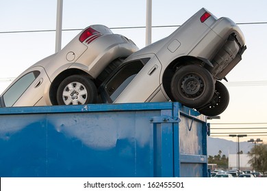 2 Junk Cars In A Dumpster