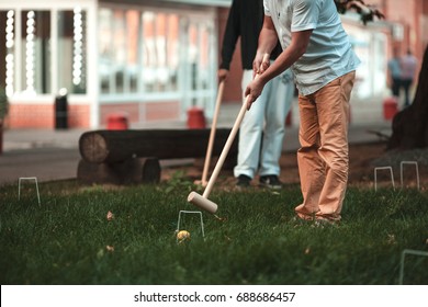 2 Men Playing Croquet