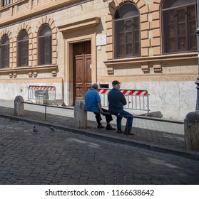 2 men staring at wall