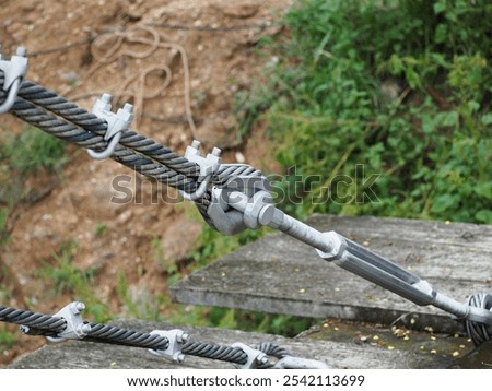 2 new condition U-bolts bonded to the wire rope for strong rope to be used for fasten steel wire used to stretch the bridge. U-bolt is bolt shaped in the shape of U with threaded threads at both ends