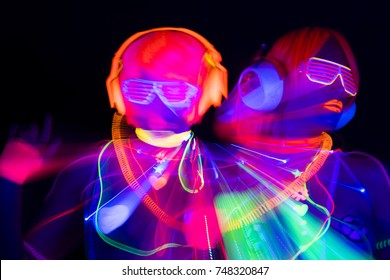 2 Sexy Cyber Glow Raver Women Filmed In Fluorescent Clothing Under UV Black Light