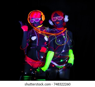 2 Sexy Cyber Glow Raver Women Filmed In Fluorescent Clothing Under UV Black Light