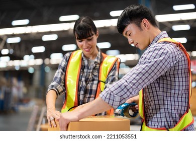 2 Staff Worker Working In The Large Depot Storage Warehouse Happy Smiling Packing Box At Cashier Counter