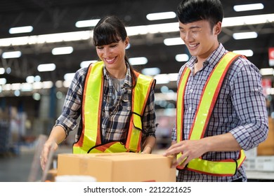 2 Staff Worker Working In The Large Depot Storage Warehouse Happy Smiling Packing Box At Cashier Counter