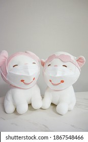 2 Stuffed Animal (cat) Wearing Smiley Face Masks