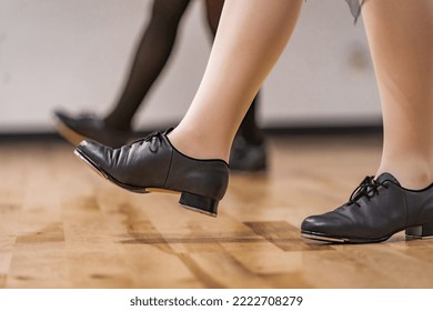 2 Women in Tap Dancing Class in Studio, Tap Shoe Closeup, Wood Floors - Powered by Shutterstock