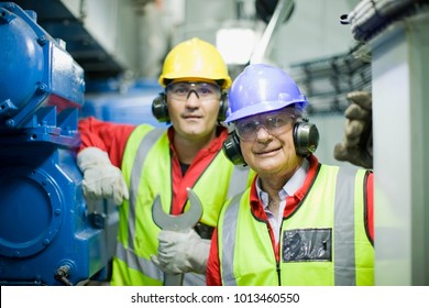 2 Workers In Engine Room