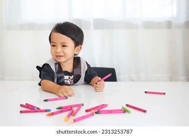 2 year old boy learning to draw and paint - Powered by Shutterstock