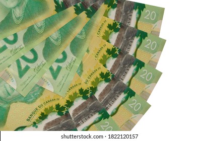 20 Canadian Dollars Bills Lies Isolated On White Background With Copy Space Stacked In Fan Shape Close Up