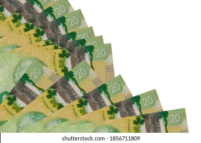 20 Canadian Dollars Bills Lies Isolated On White Background With Copy Space Stacked In Fan Close Up