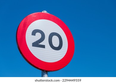 20 kilometers per hour speed limit sign