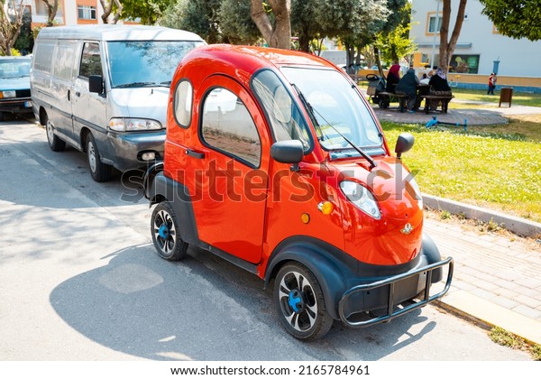 20 May 2022, Antalya, Turkey: Chinese Regal\
Raptor Motors model K5 mini electric car parked at the city street.\
Tiny and funny modern eco\
transport