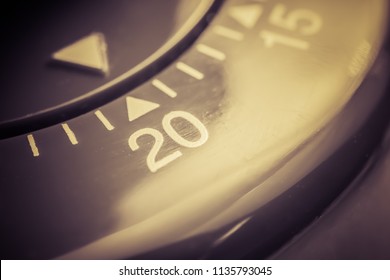 20 Minutes - Macro Of A Flat Red Kitchen Egg Timer In Sepia