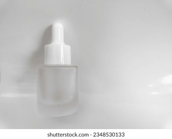20 ml mini glass serum bottle. blank packaging glass dropper serum bottle isolated on white background with clipping path ready for cosmetic product design mockup. Natural lighting
