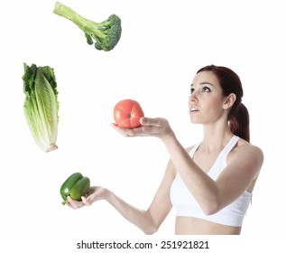 A 20 Years Old Training Woman Juggle With Vegetable