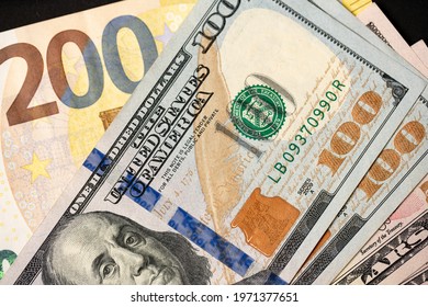 200 Euro with one hundred dollar banknotes, closeup of euro and dollars. Exchange currencies EUR and USD