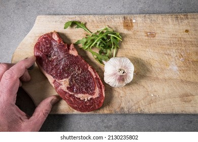 A 200 Gram Entrecote Piece Of Beef On A Cutting Board In A Kitchen.