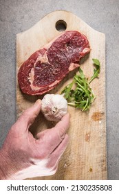 A 200 Gram Entrecote Piece Of Beef On A Cutting Board In A Kitchen.