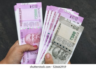 2000 And 500 Rupee Banknote India,The Brand New Indian Currency Notes Of 2000 And 500 Rupees Isolated On Black. Business Woman Holding Counting Money. Success And Got Profit From Business