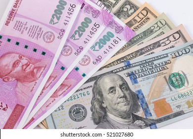 2000 rupee banknote over US dollar banknote. Economy finance trade business concept.